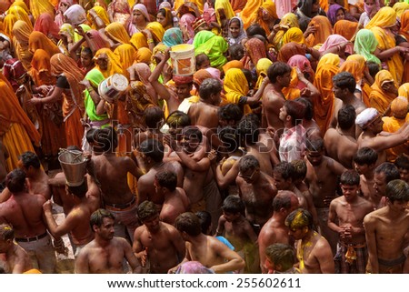 MATHURA,INDIA - March 28,2013 :Unidentified people  throw powder paints and water to each other during the Holi celebration in Mathura.Holi Festival is one of the most colorful event in the world