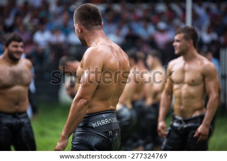EDIRNE,TURKEY - July 5, 2013 :Unidentified oil wrestlers in Kirkpinar Wrestling Festival.Wrestlers oil their body and start wrestling.It is traditional and taken into UNESCO cultural heritage program.