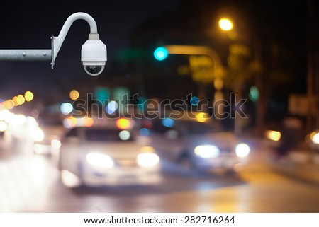 CCTV camera or surveillance Operating on at night traffic road.