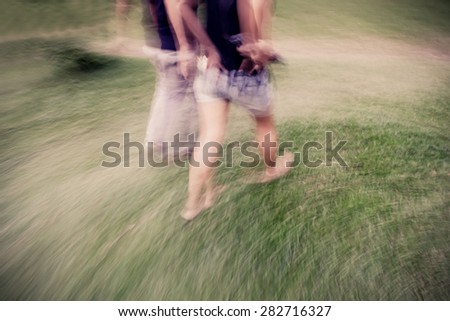 blur people walking in park. motion blur.