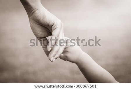hands of mother and child. vintage tone