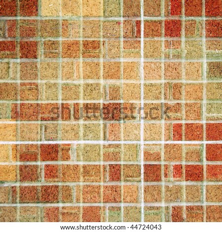 A square brick tile background made from red, brown, and tan square bricks.