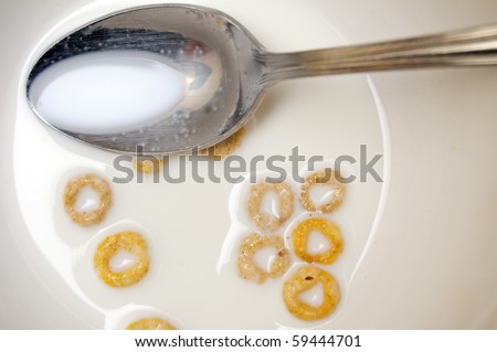 Eaten breakfast cereal in a bowl with milk and spoon