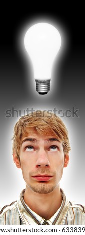 A young adult white Caucasian teenage man looking directly above at a glowing light bulb. Professionally retouched.
