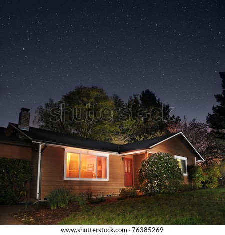 Family home at night underneath the stars
