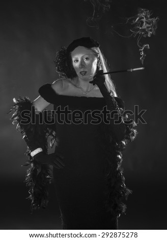 Elegant Black and White Portrait of Glamorous Woman Smoking Cigarette and Dressed in Vintage Clothing, Three Quarter Length Portrait in 1940s Film Noir Style