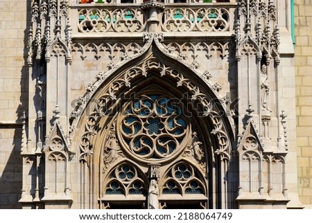 Similar – Image, Stock Photo Rose window and sculpted filigrees at the front of a gothic cathedral