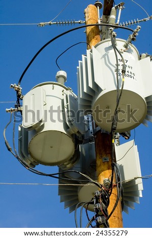 Power Transformers Attached To A Wooden Pole Convert Three Phase Power ...