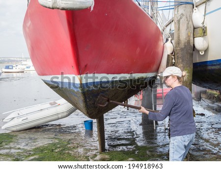 Woman cleaning boat