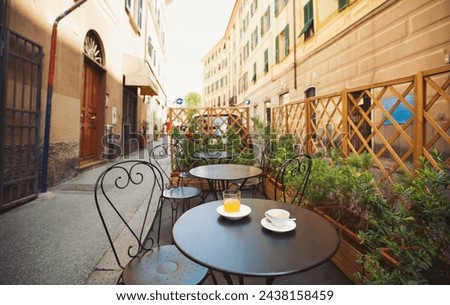 Similar – Image, Stock Photo Bistro street cafe chairs and tables parked in lockdown