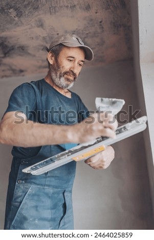 Similar – Image, Stock Photo Plasterer renovating indoor walls and ceilings.