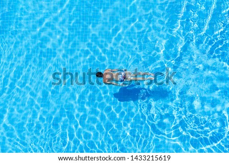 Similar – Image, Stock Photo Man swimming under water in sea