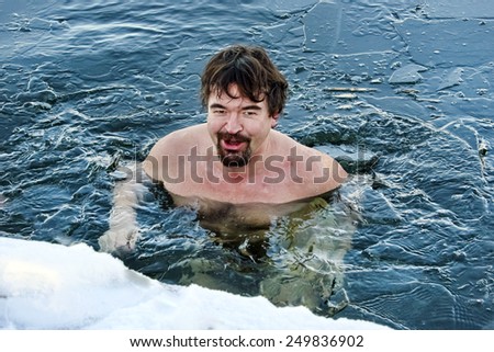 Bearded man in cold water, winter swimming