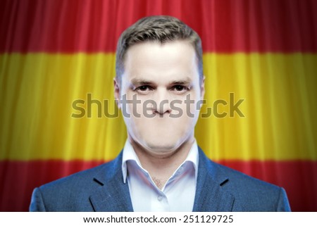 Symbol of censorship and freedom of speech: a young man without a mouth on a background of the national flag of Spain