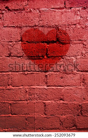 Red painted brick wall texture, picture of red heart fof Valenti