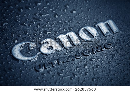 KAZAN, RUSSIA, 15 March 2015: water drops on the Canon logo