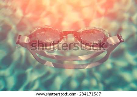 Swimming sport goggles in the water