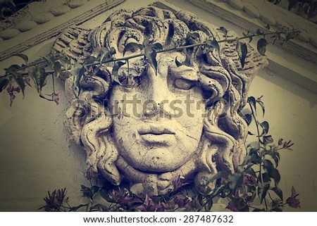 Sculpture greek with ivy