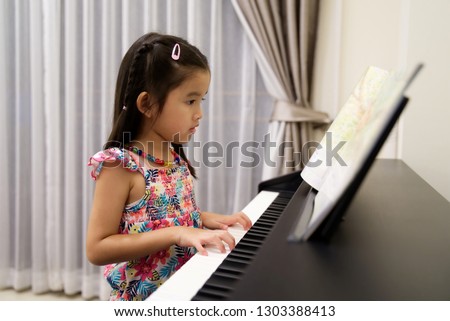 Similar – Image, Stock Photo Child practicing piano