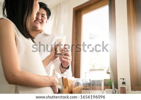 Similar – Image, Stock Photo Newborn drinking milk from a baby bottle, sitting on mom legs outdoors