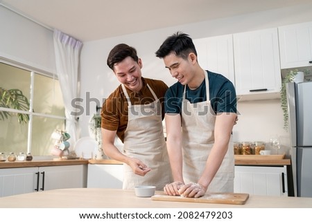 Similar – Image, Stock Photo Romantic Gay couple working together at home with their laptops.