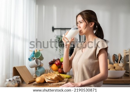 Similar – Image, Stock Photo young beautiful woman drinking coffee or tea camping outdoors with a van and her two dogs. Travel concept