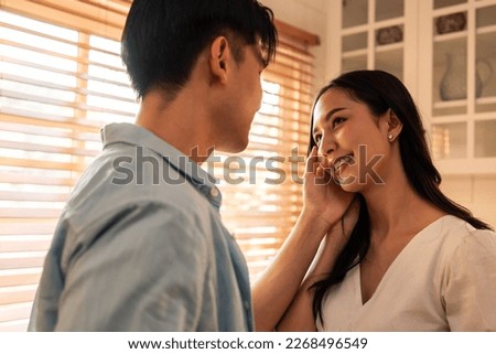 Similar – Image, Stock Photo Loving couple looking at each other