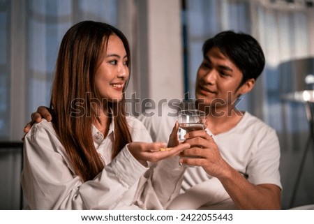 Similar – Image, Stock Photo Young couple taking a selfie while kissing in the mountains