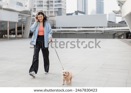 Similar – Image, Stock Photo Adorable girl walking and looking at camera on seaside at sunset