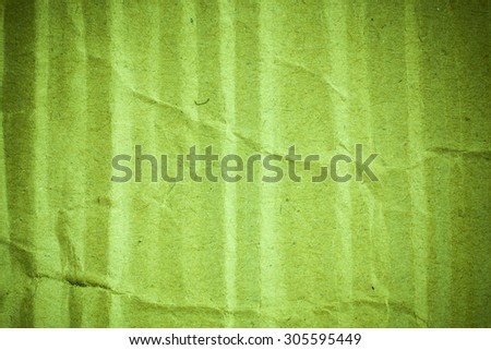 Green cardboard paper background vignette.