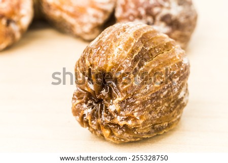Close up and selective focus on the dried honey dates at the foreground