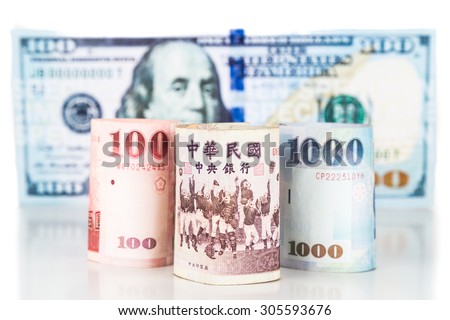 Close up of New Taiwan currency note against US Dollar.