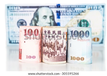 Close up of New Taiwan currency note against US Dollar.