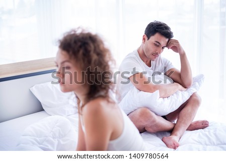 Portrait of newlywed have a fight in bed. The couple having difficulties in relationship. Wife always sulking & husband get angry easily. He has problem with erection too. Domestic violence concept.  Stockfoto © 