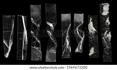 cool set of transparent adhesive tape or strips isolated on black background, crumpled plastic sticky snips, poster design overlays or elements.