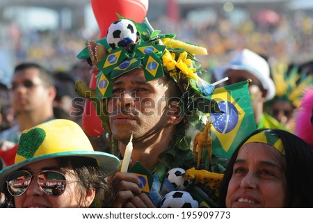 RIO DE JANIERO, BRAZIL - JUNE 10 2010 fans celebrate the victory of Brazil in the arena FIFA fan fest on Copacabana beach