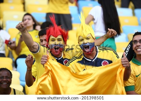 RIO DE JANEIRO, BRAZIL - June 28, 2014:  soccer fans celebrating at the 2014 World Cup Round of 16 game between Colombia and Uruguay at Maracana Stadium. No Use in Brazil.