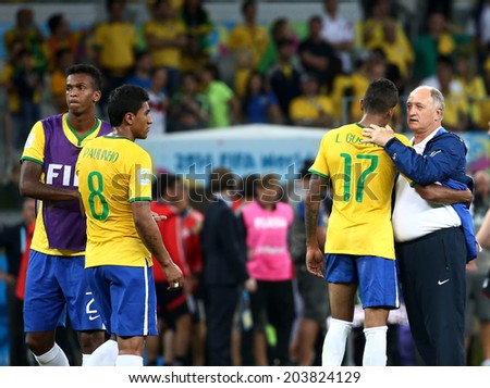 BELO HORIZONTE, BRAZIL - July 8, 2014: Scholari coach and players of Brazil at the end of the World Cup Semi-finals game between Brazil and Germany at Mineirao Stadium. NO USE IN BRAZIL.