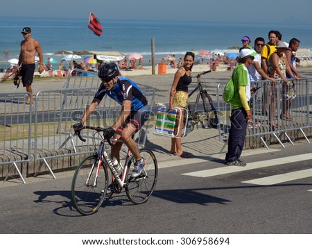 Competitors ride near Barra da Tijuca  beach during the Road Cycling Challenge in Rio de Janeiro, Brazil, August 16, 2015.  Road Cycling  is a test event for the Rio 2016 Olympic Games.