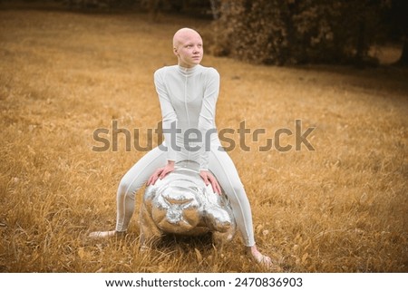 Similar – Image, Stock Photo teenager with wig sitting on a sofa next to a fish