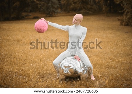 Similar – Image, Stock Photo teenager with wig sitting on a sofa next to a fish