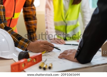 Real estate agents and construction team leaders work together. View house designs and renovate house plans. Construction projects. Mortgage, rent, buy, sell, buy, move, sell houses. ストックフォト © 