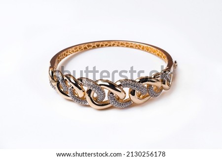 women's gold arm bracelet on a white background Foto stock © 