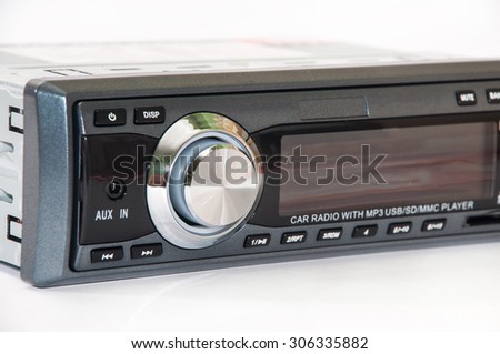 Car mp3 radio player over white background.