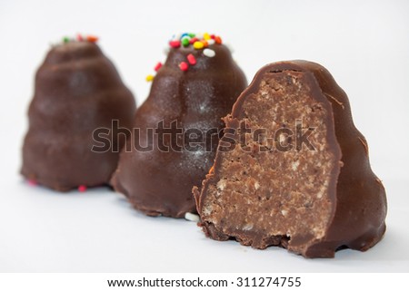 Chocolate cakes in the shape of a cone cut in half.