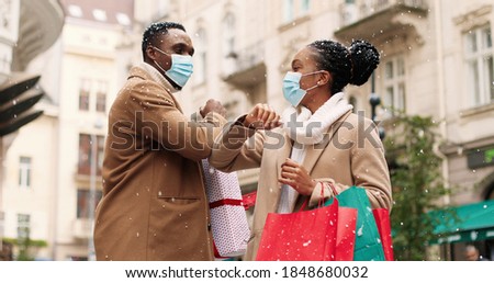 Similar – Image, Stock Photo Young woman in christmassy clothes looks smiling at a christmas present