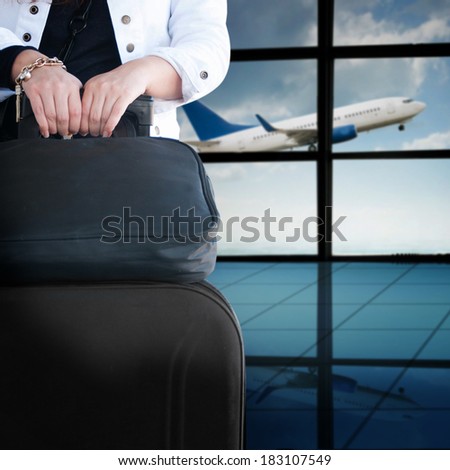 Woman with luggage in the airport