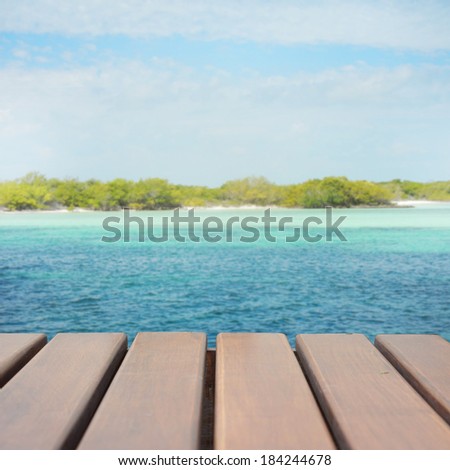 wood terrace on the beach and sun light