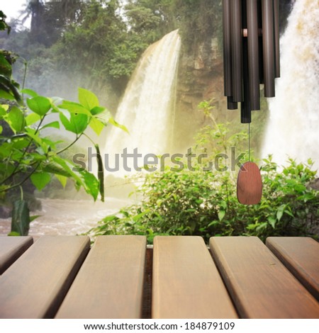 Wooden terrace and waterfall