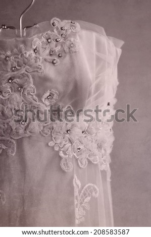 Close up detail of vintage style wedding dress on a hanger